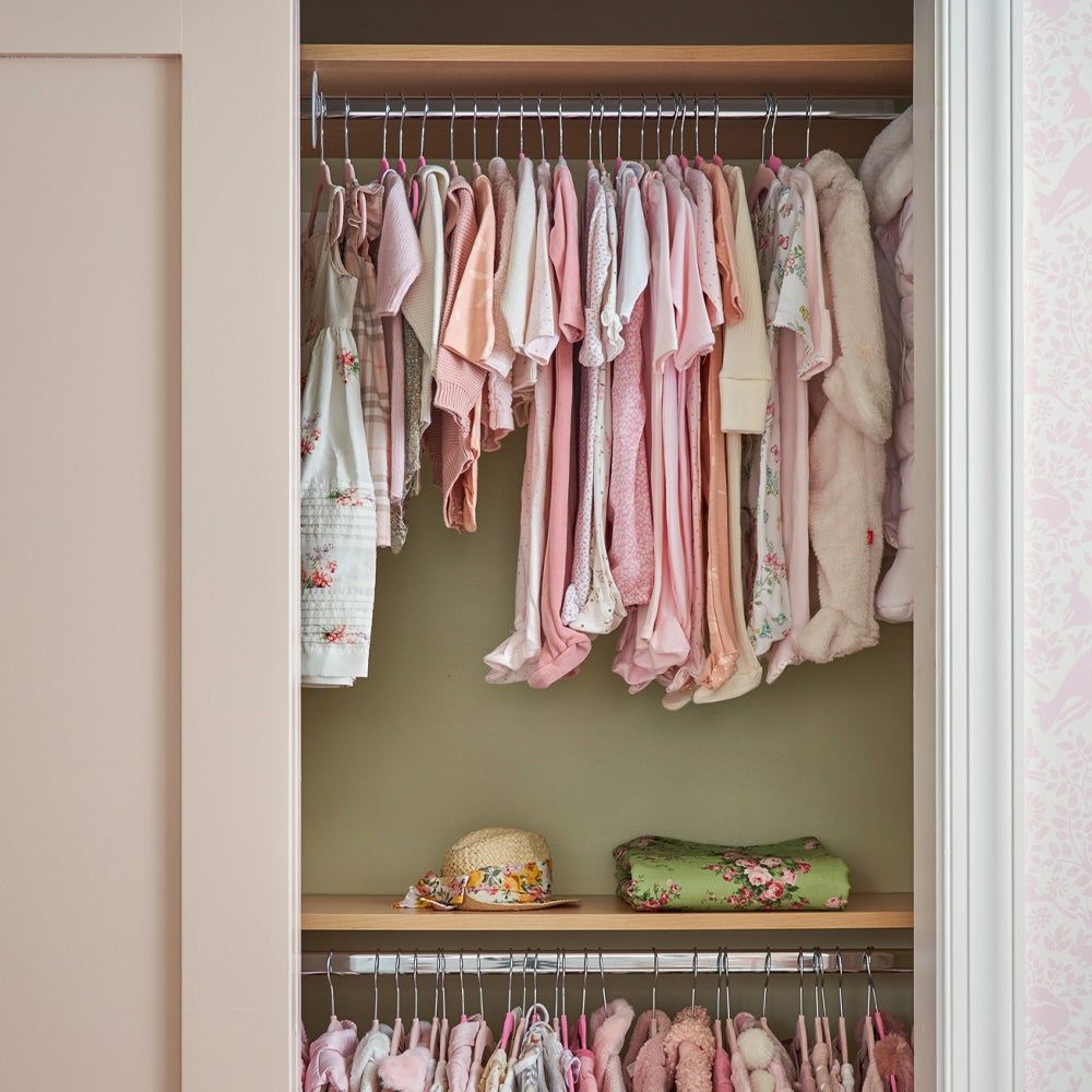 kids clothing hanging in a closet 