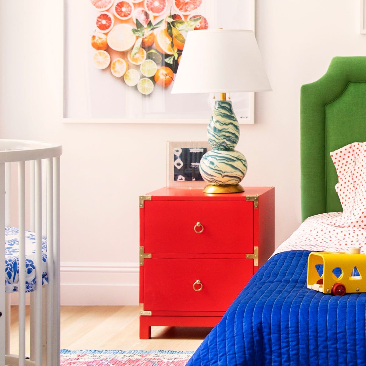 A red nightstand in a children's bedroom