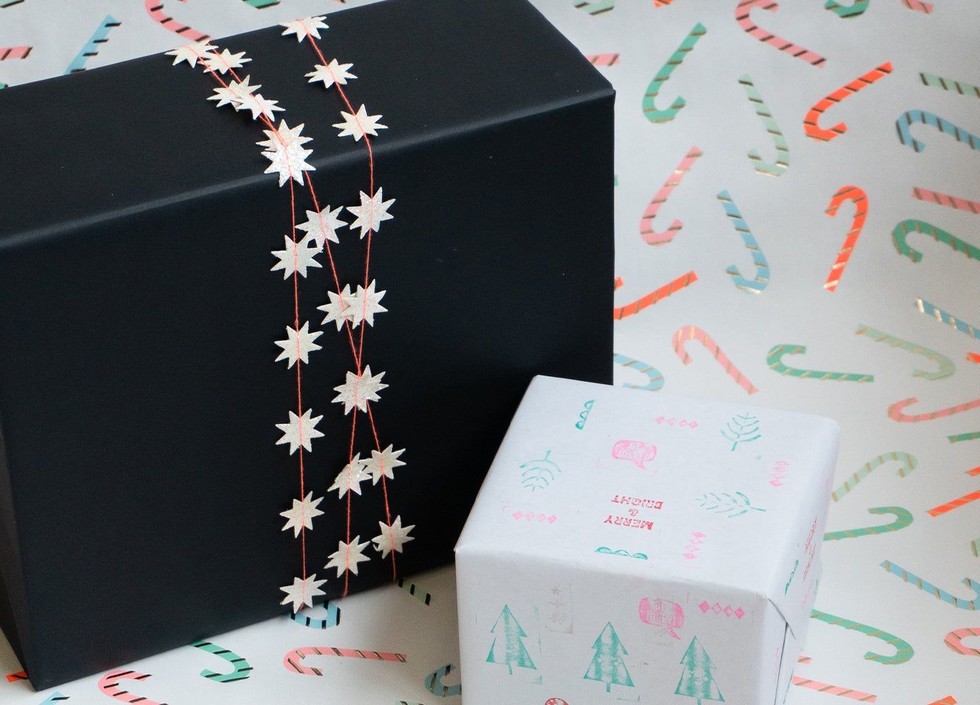 using holiday garland as a gift wrap topper