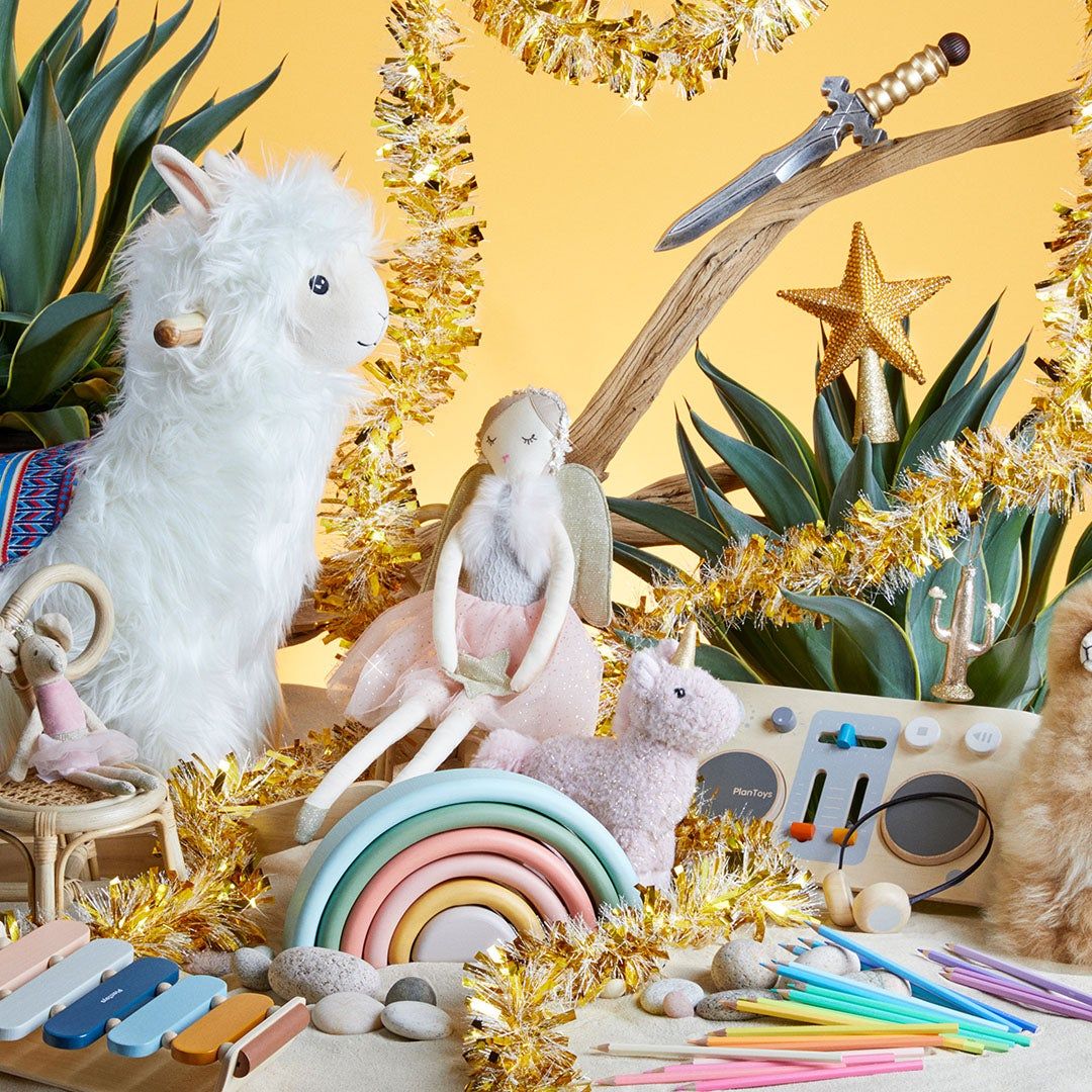 holiday still life with llama rocker, angel doll, xylophone, various small toys