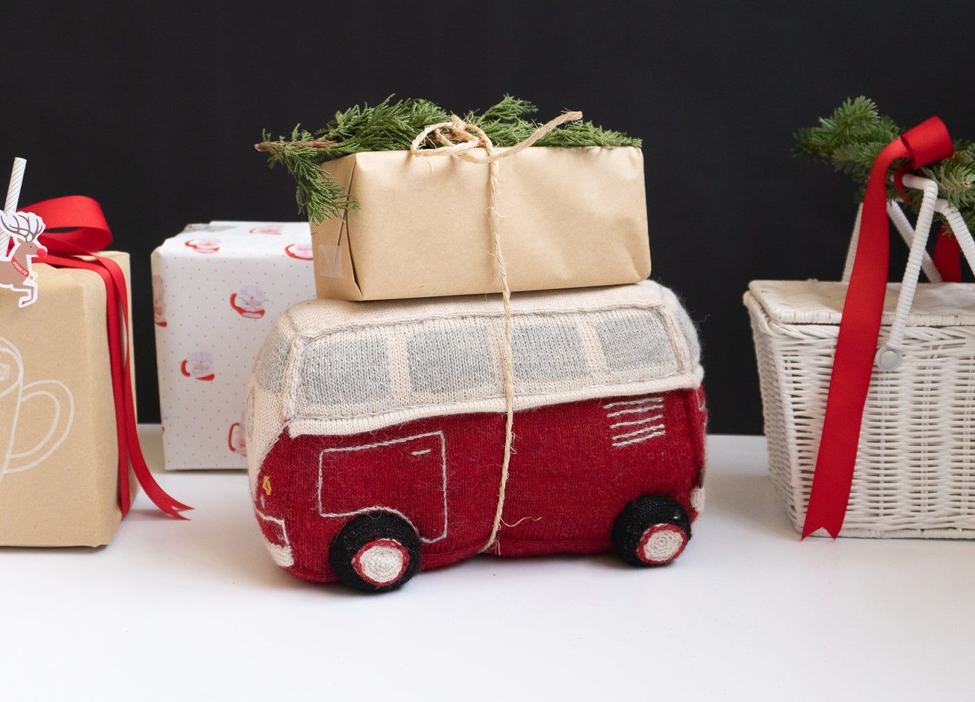 plush vehicle toy with a tiny gift on top