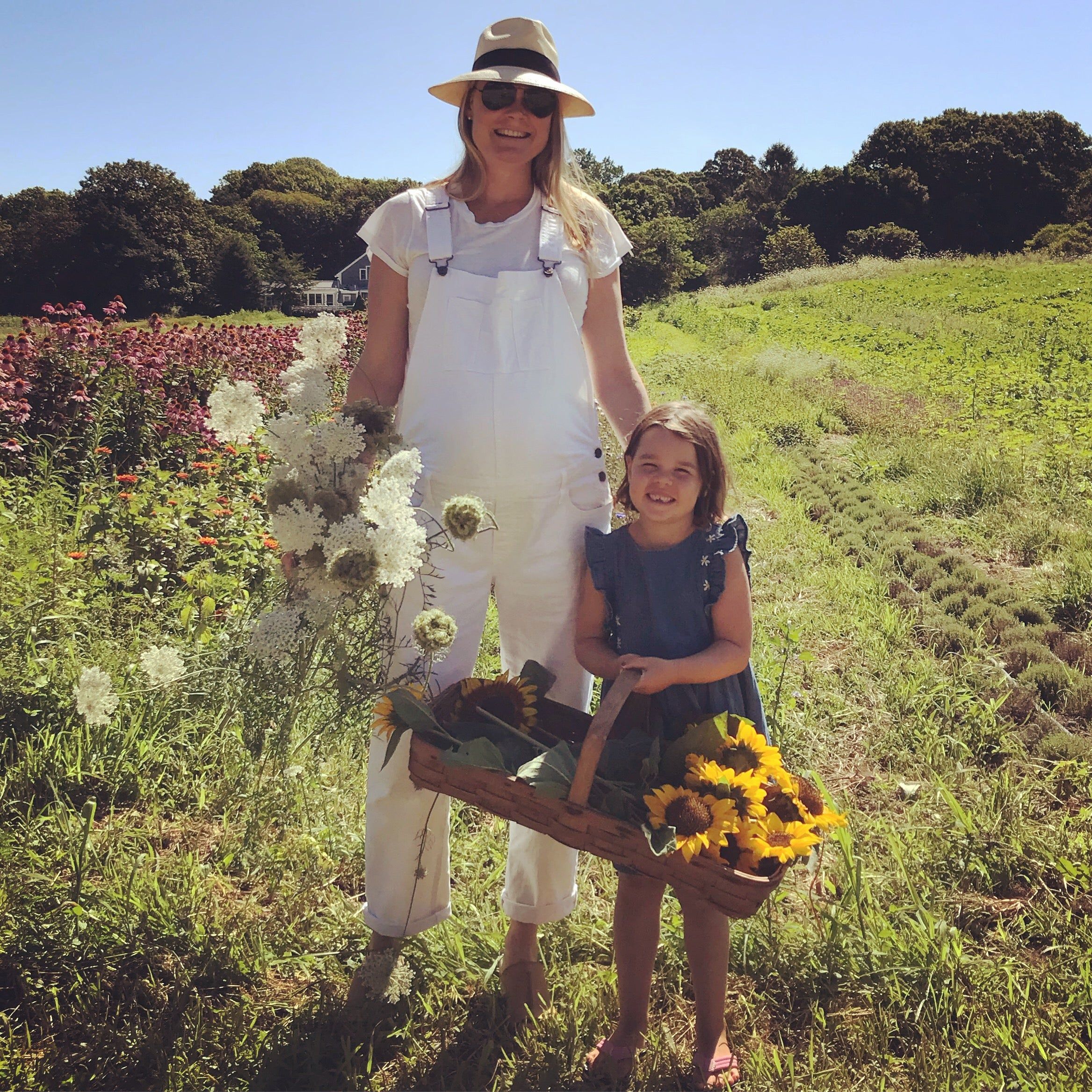 Kate and oldest daughter in a field of flowers