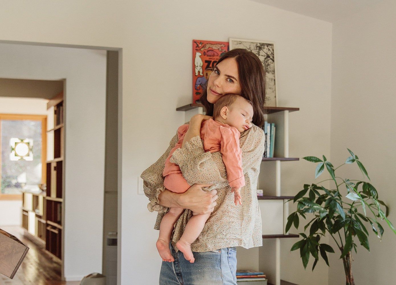 Amanda Chantal Bacon holds her sleeping daughter.