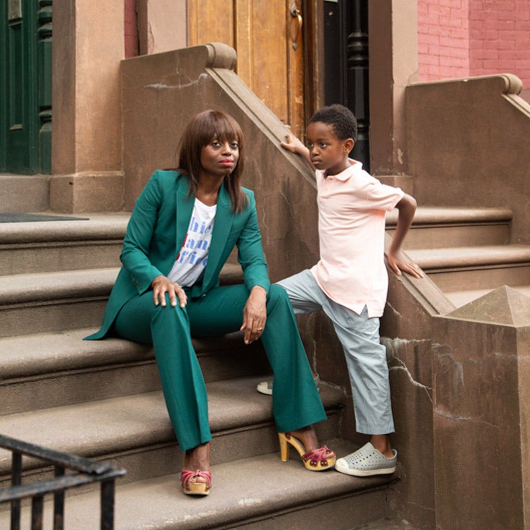 Dee Poku and her son on brownstone steps 
