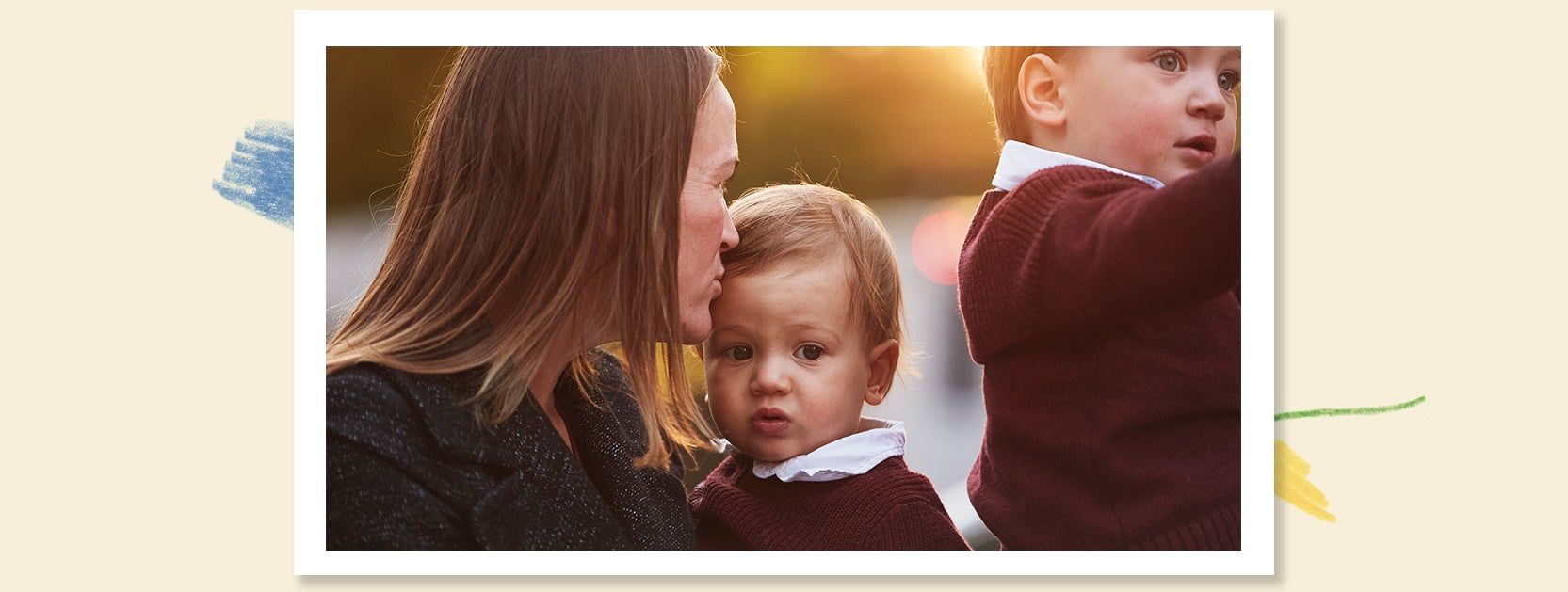 mother and two small boys posing for holiday photos