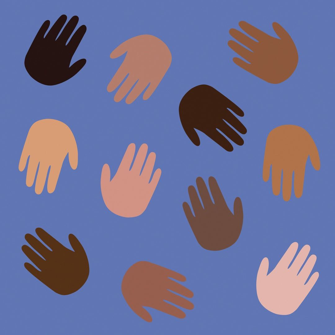 children's hands in a range of skin tones 