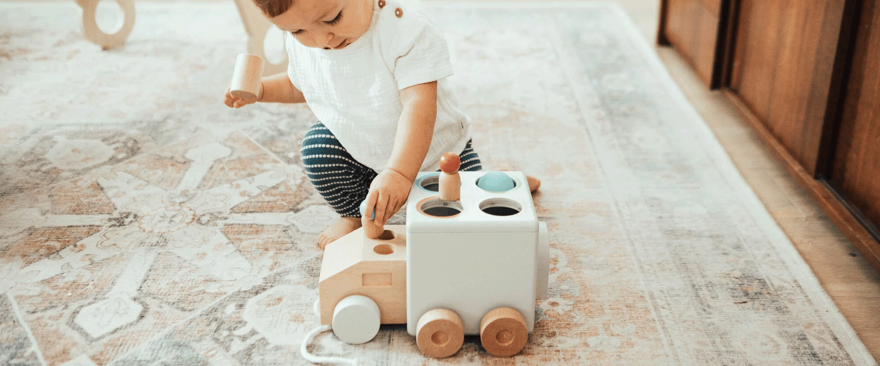 baby boy playing with toy