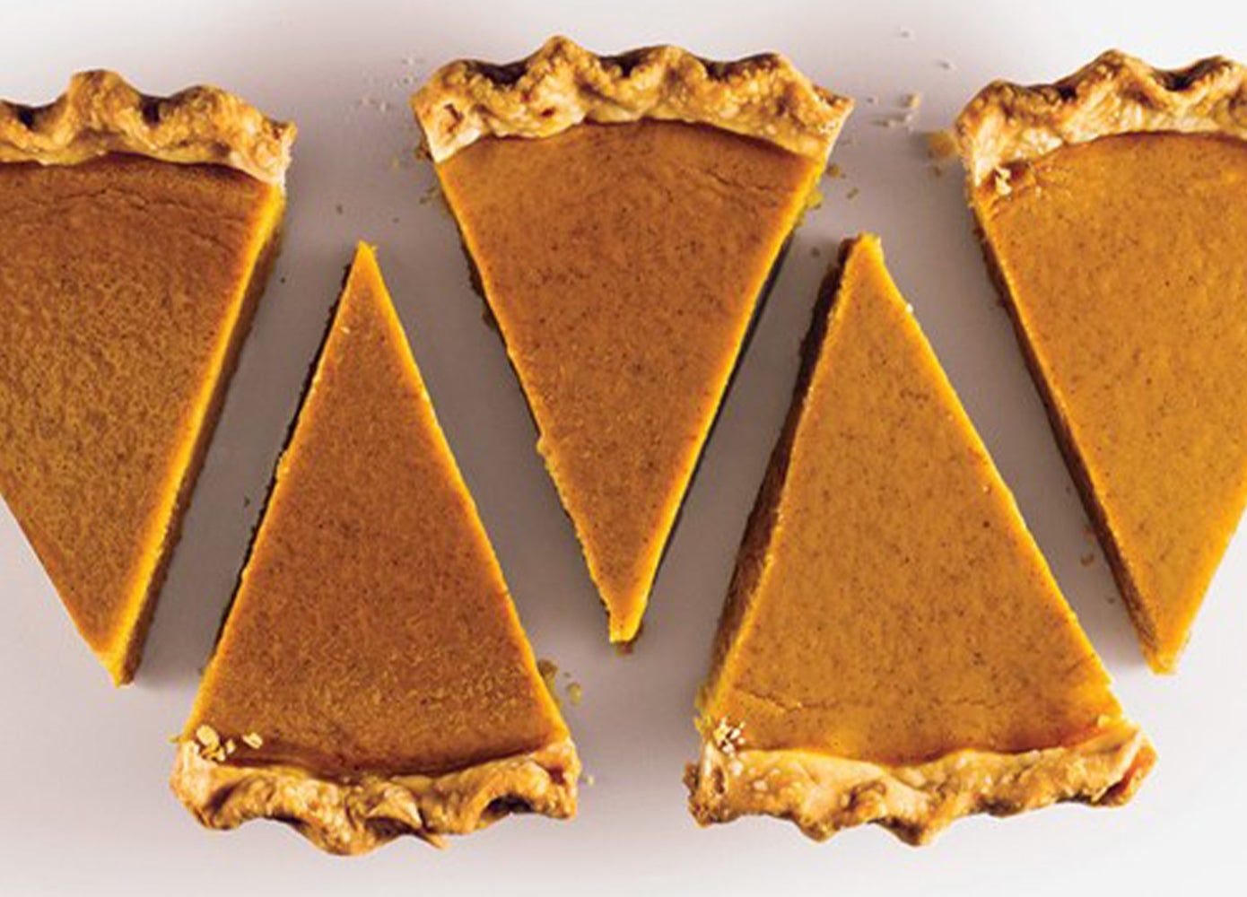 Overhead photo of five slices of pumpkin pie