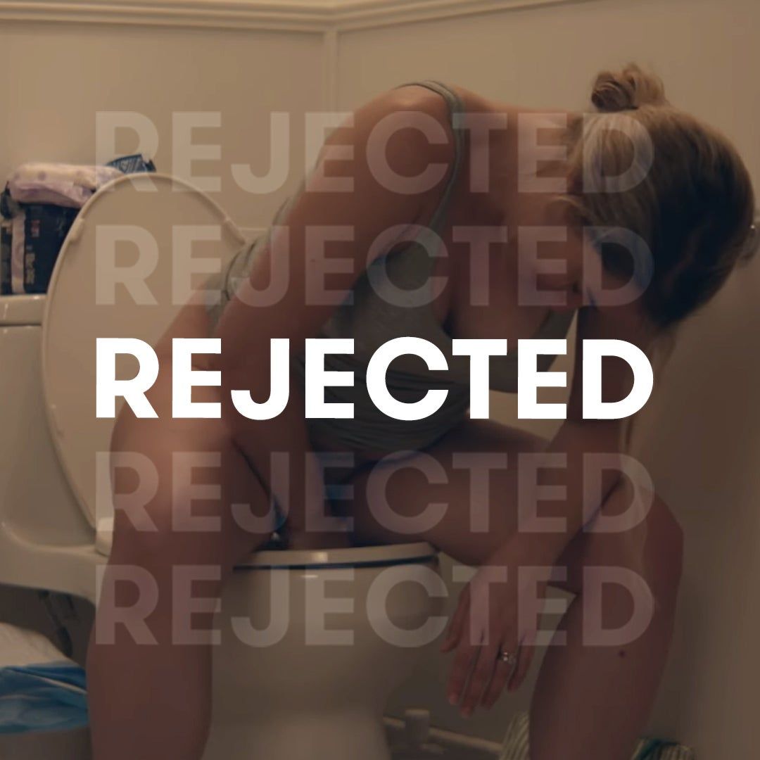 woman sitting on the toilet with word "rejected" over it