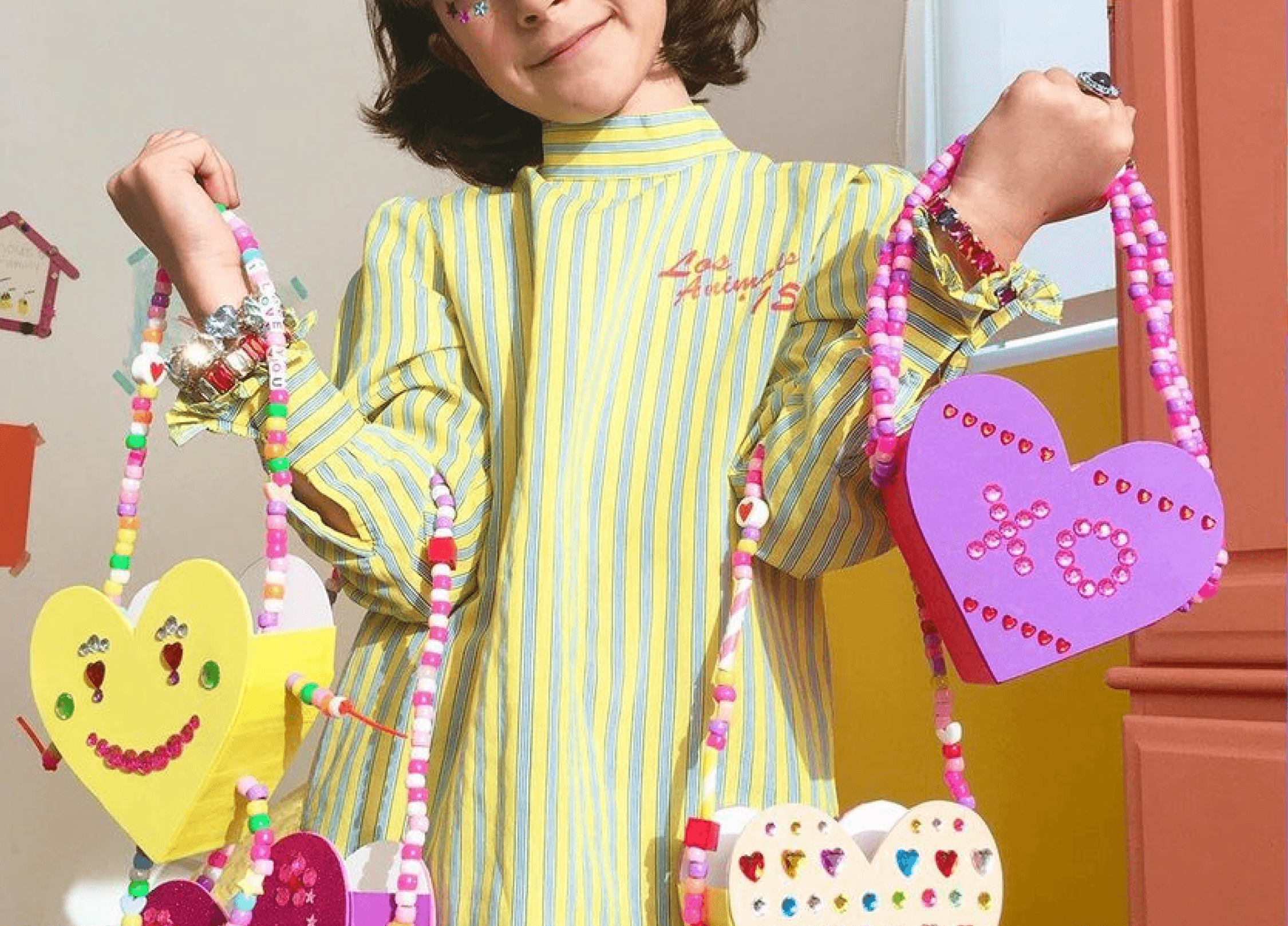 A tree with fingerprints shaped into a heart painted onto a piece of paper