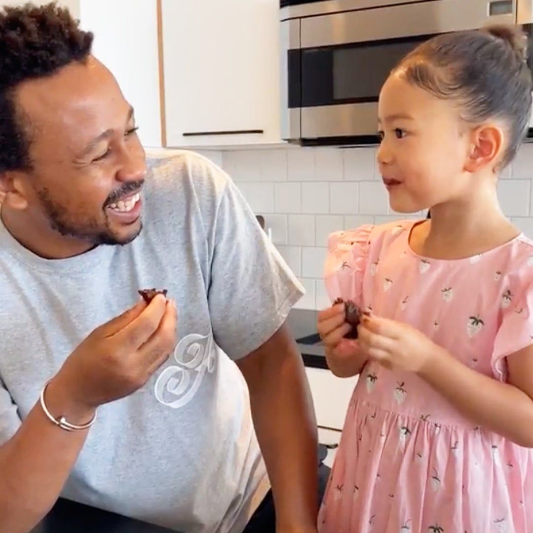 man and daughter eating a treat