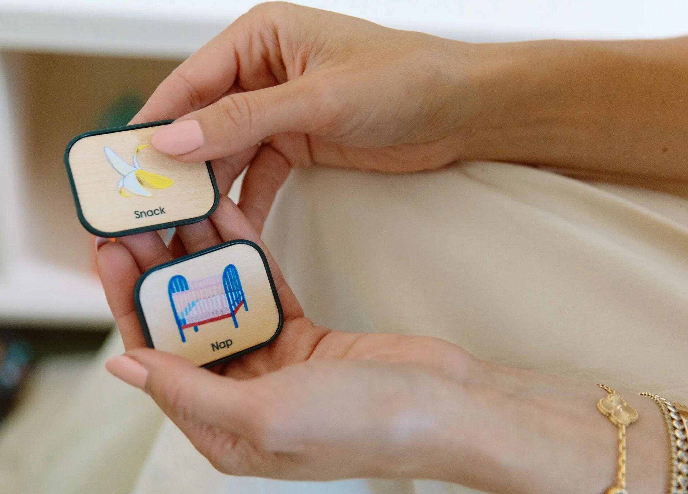 A mother choose tiles for her visual scheduler for her child.