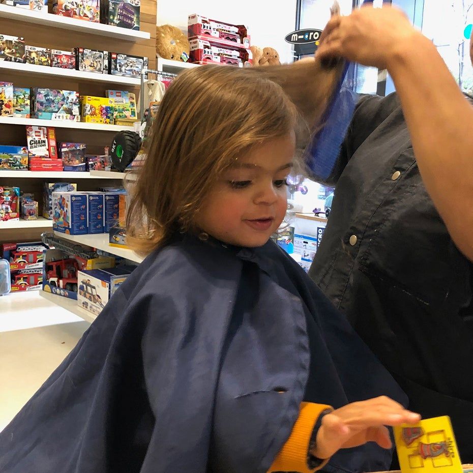 child getting their first hair cut
