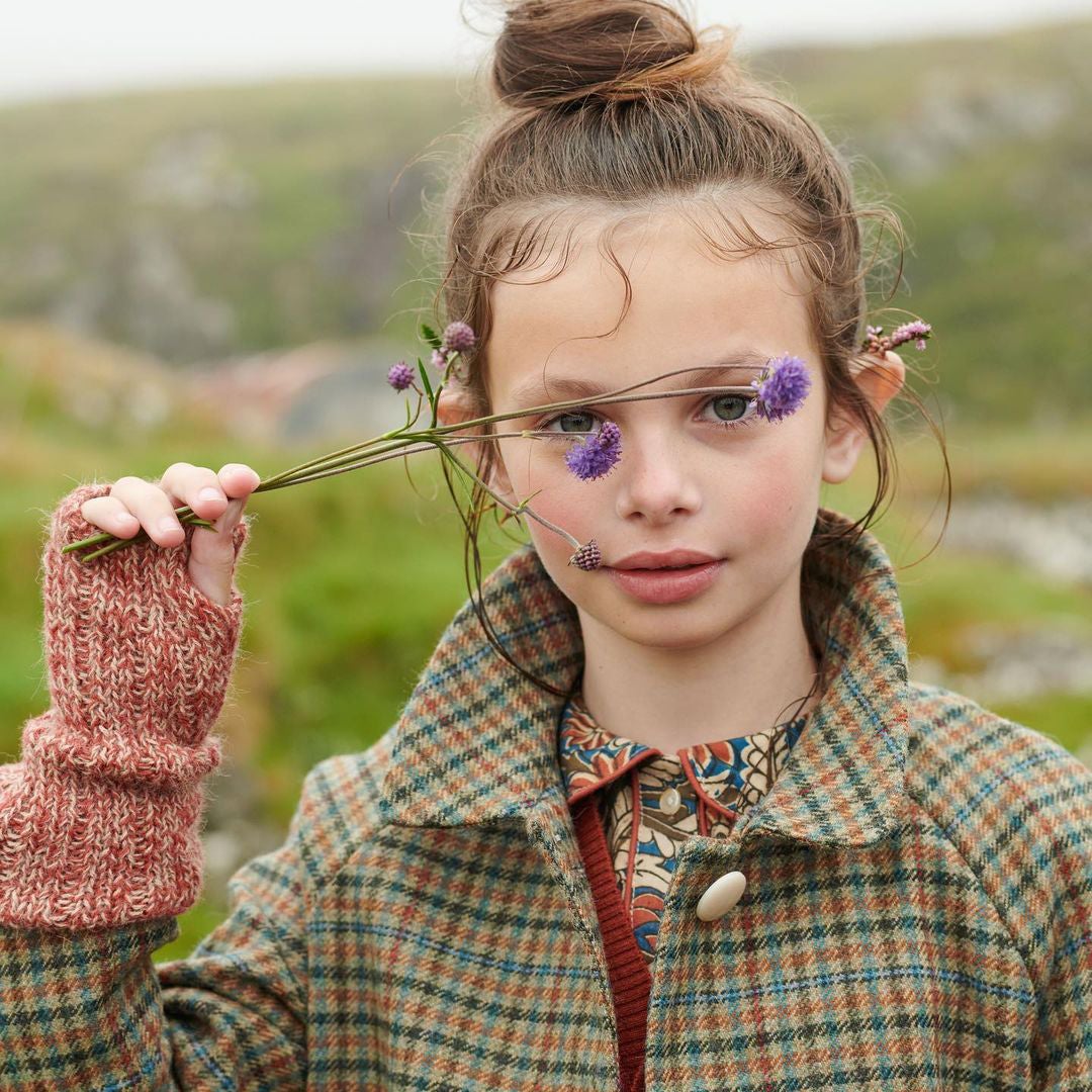 boy wearing fingerless gloves