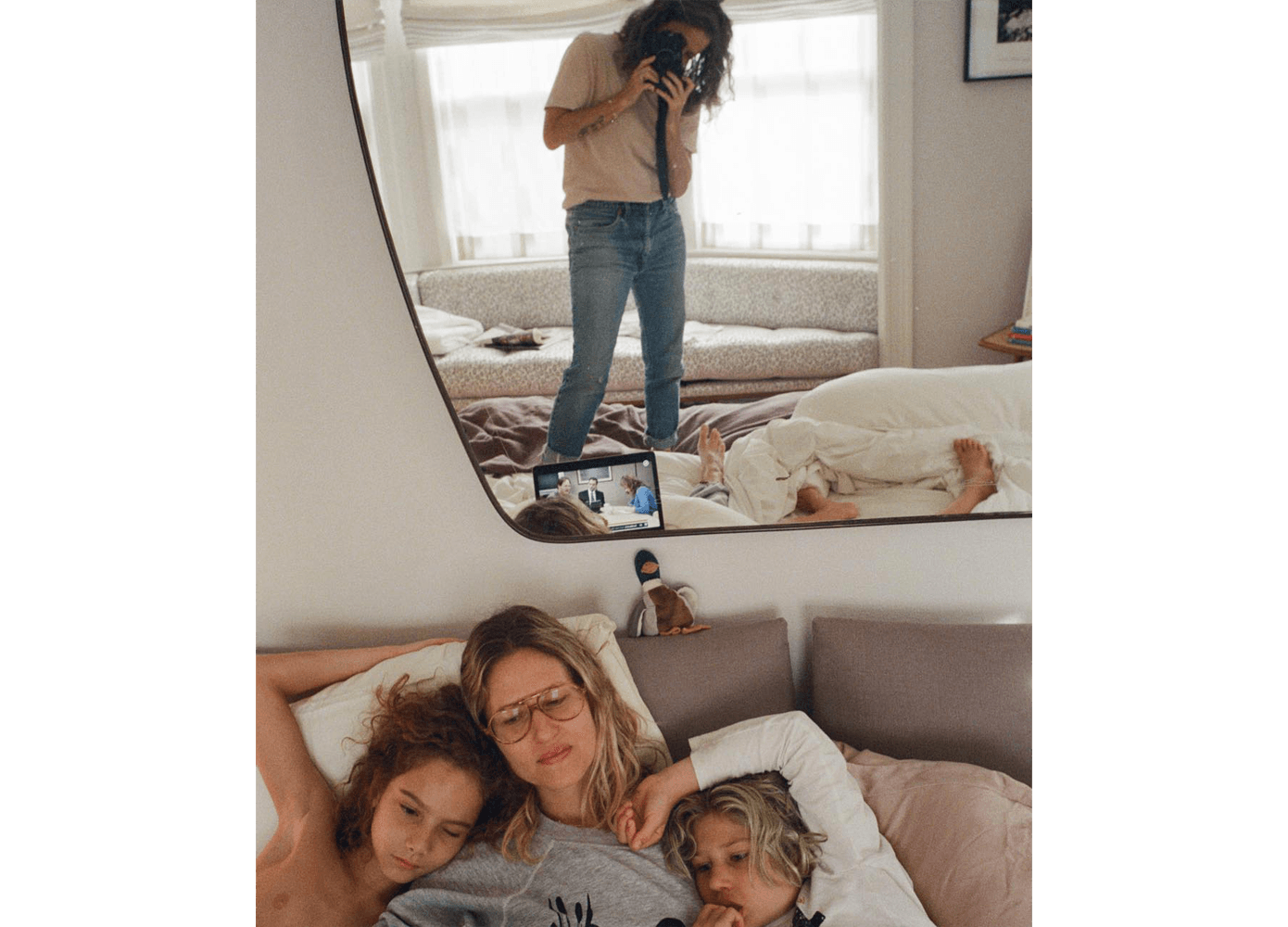 Photographer Cass Bird photographing her family in a mirror
