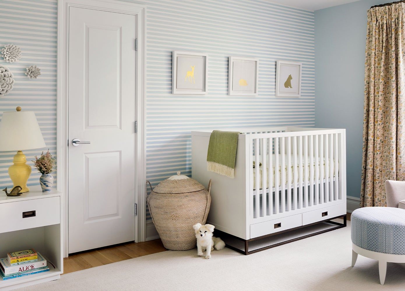 crib in front of a pale blue wall