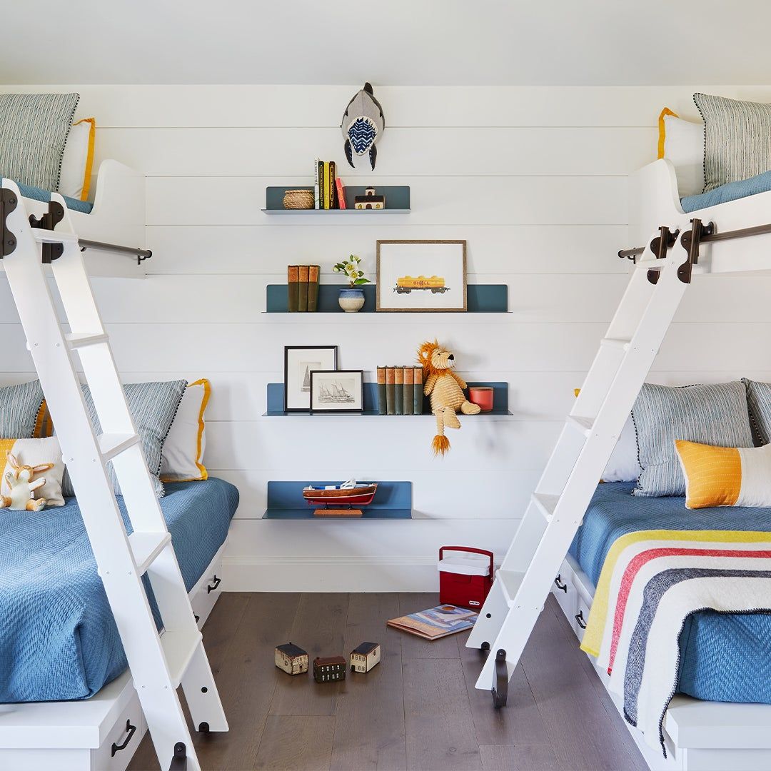 two sets of bunk beds in a child's room
