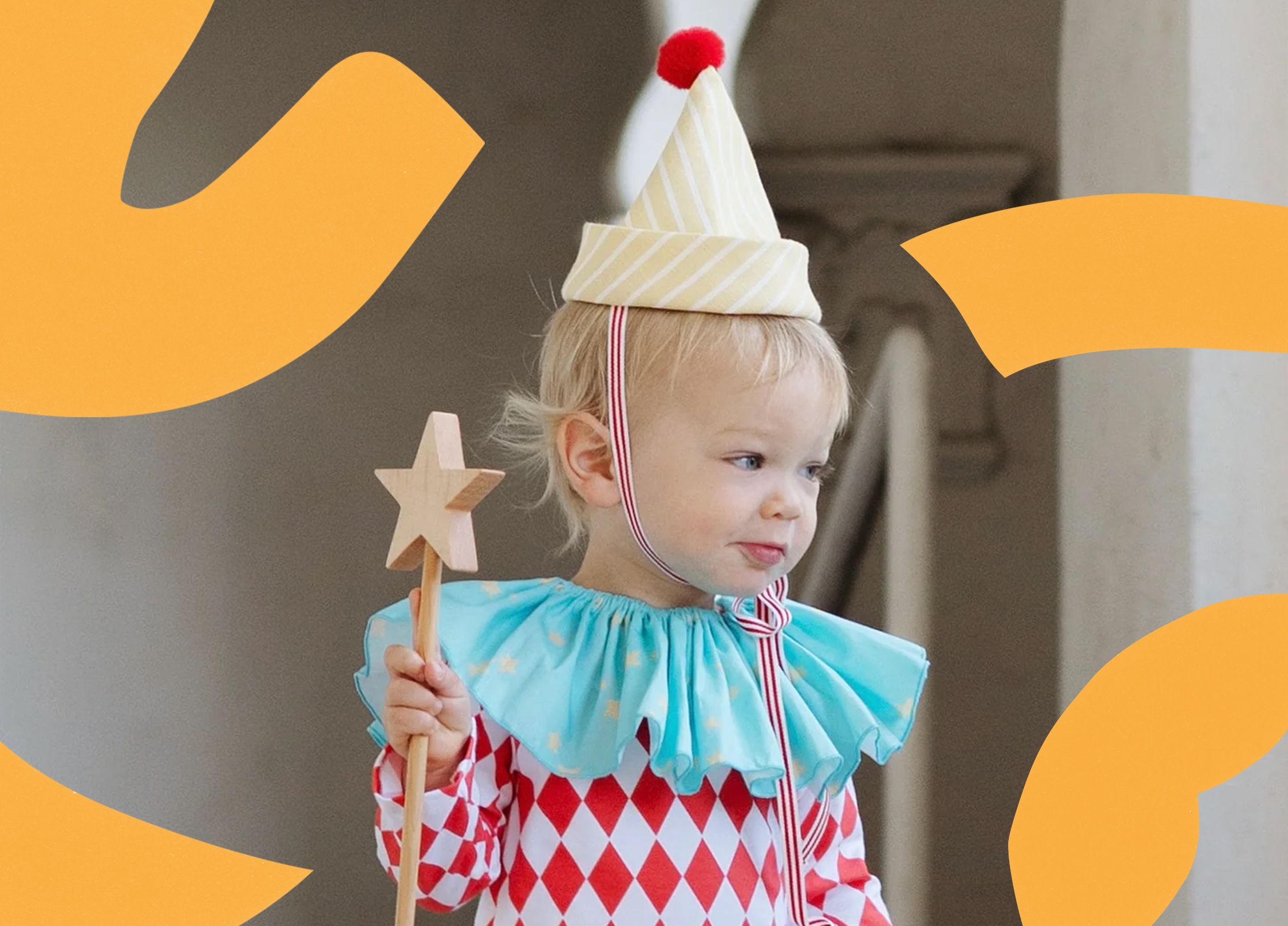 A young child dressed as a vintage clown.