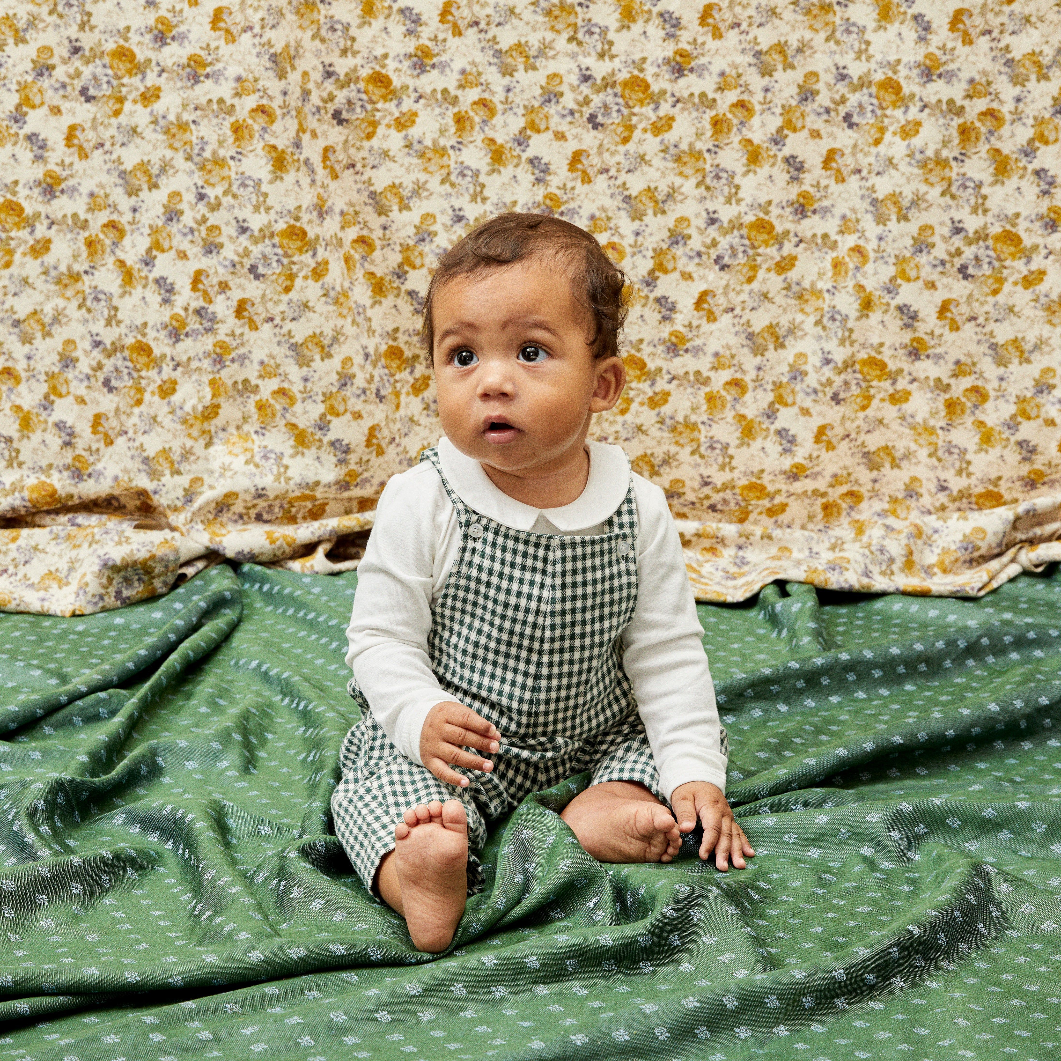 baby in gingham overalls from Maison Me