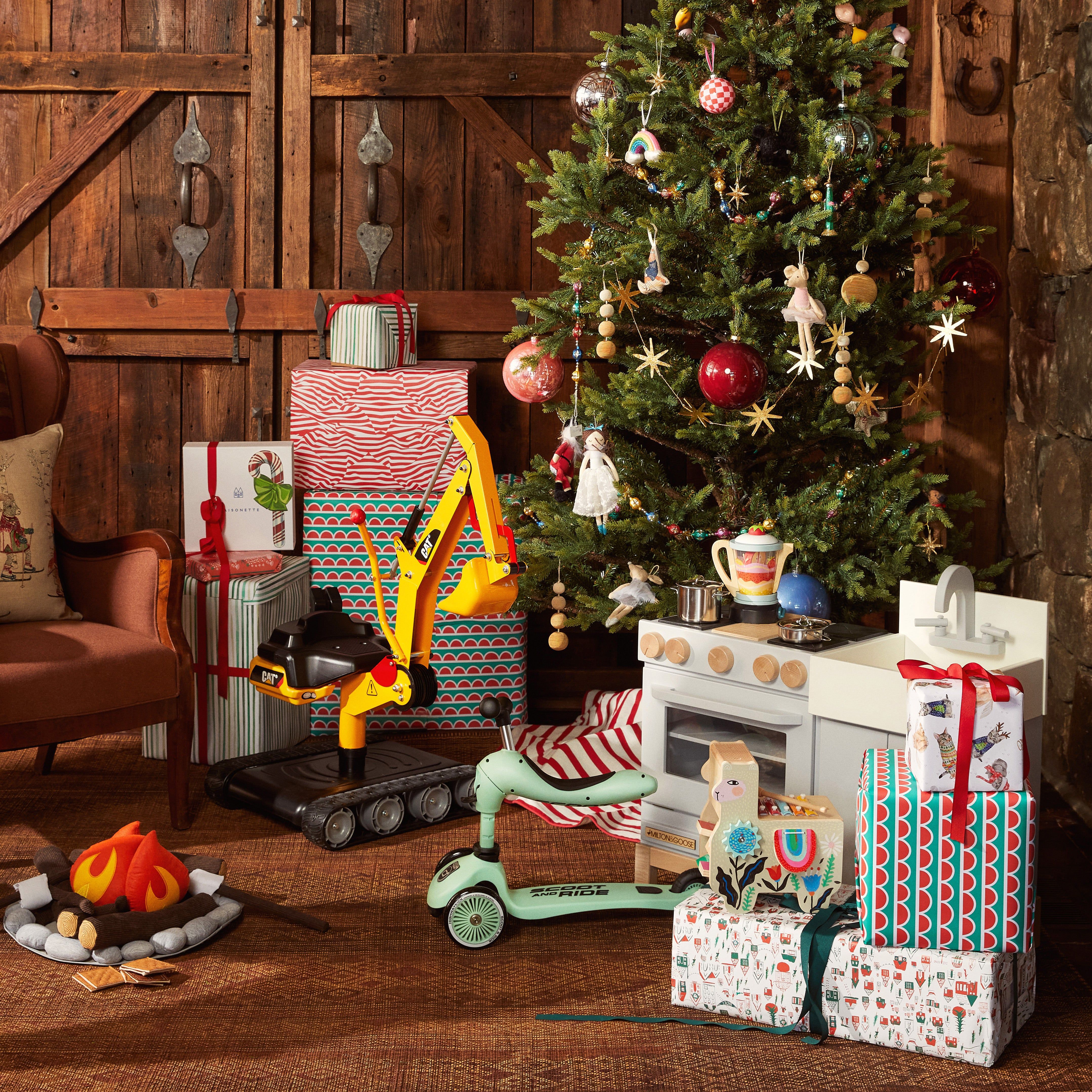 Christmas tree decorated with presents and ornaments for babys first Christmas