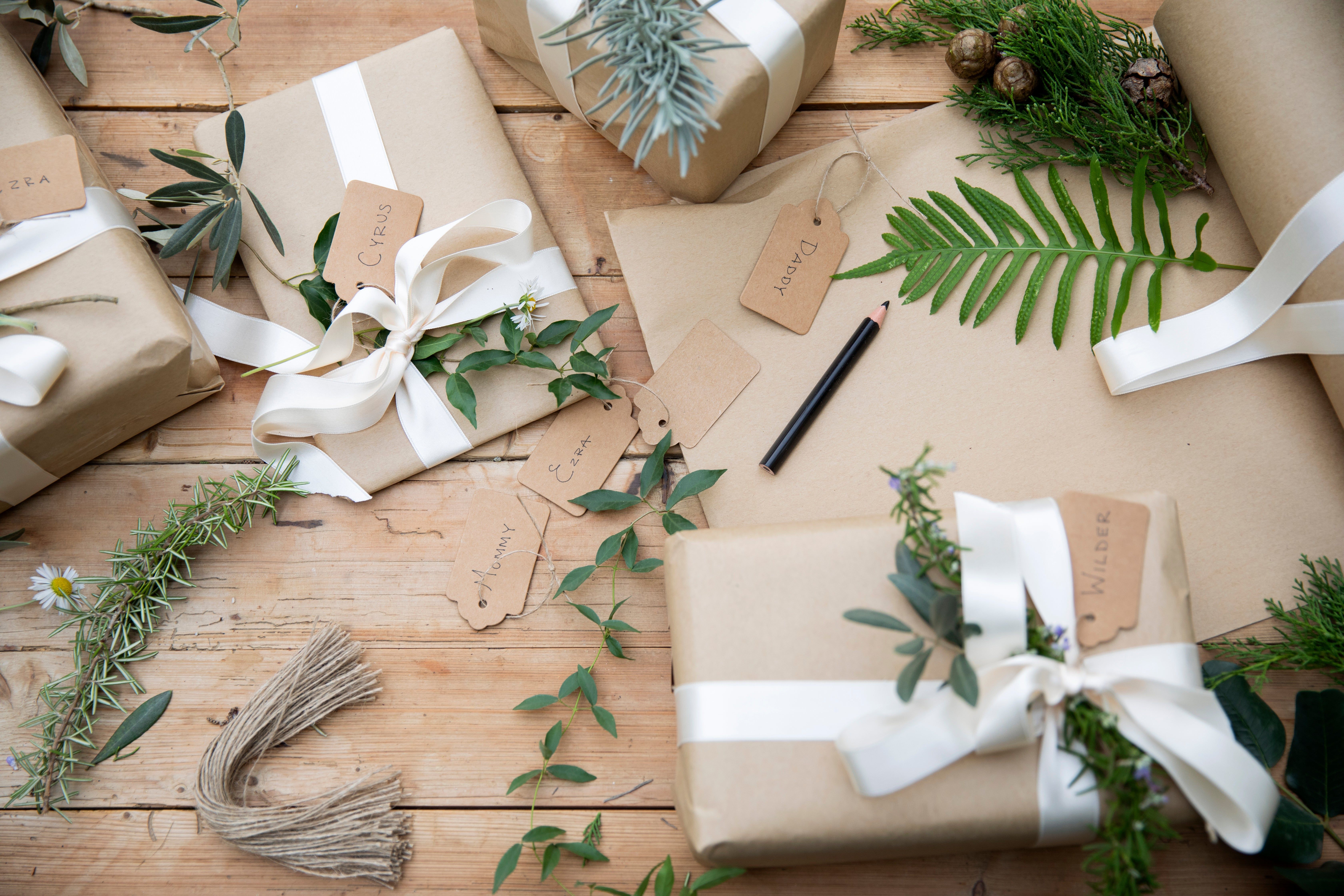 giftwrap station with foraged materials like rosemary pinecones and ferns