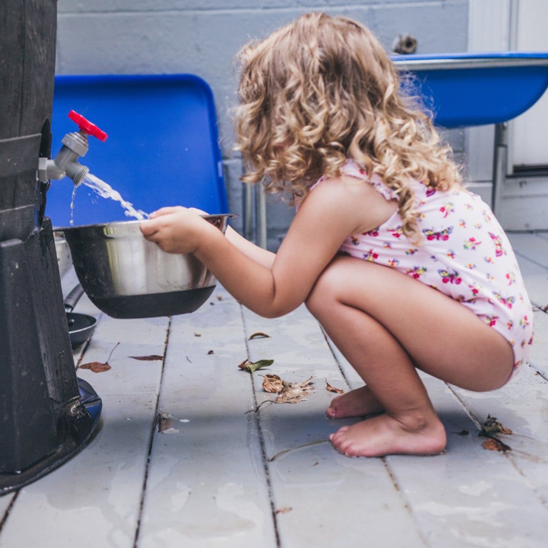 toddler playing with water