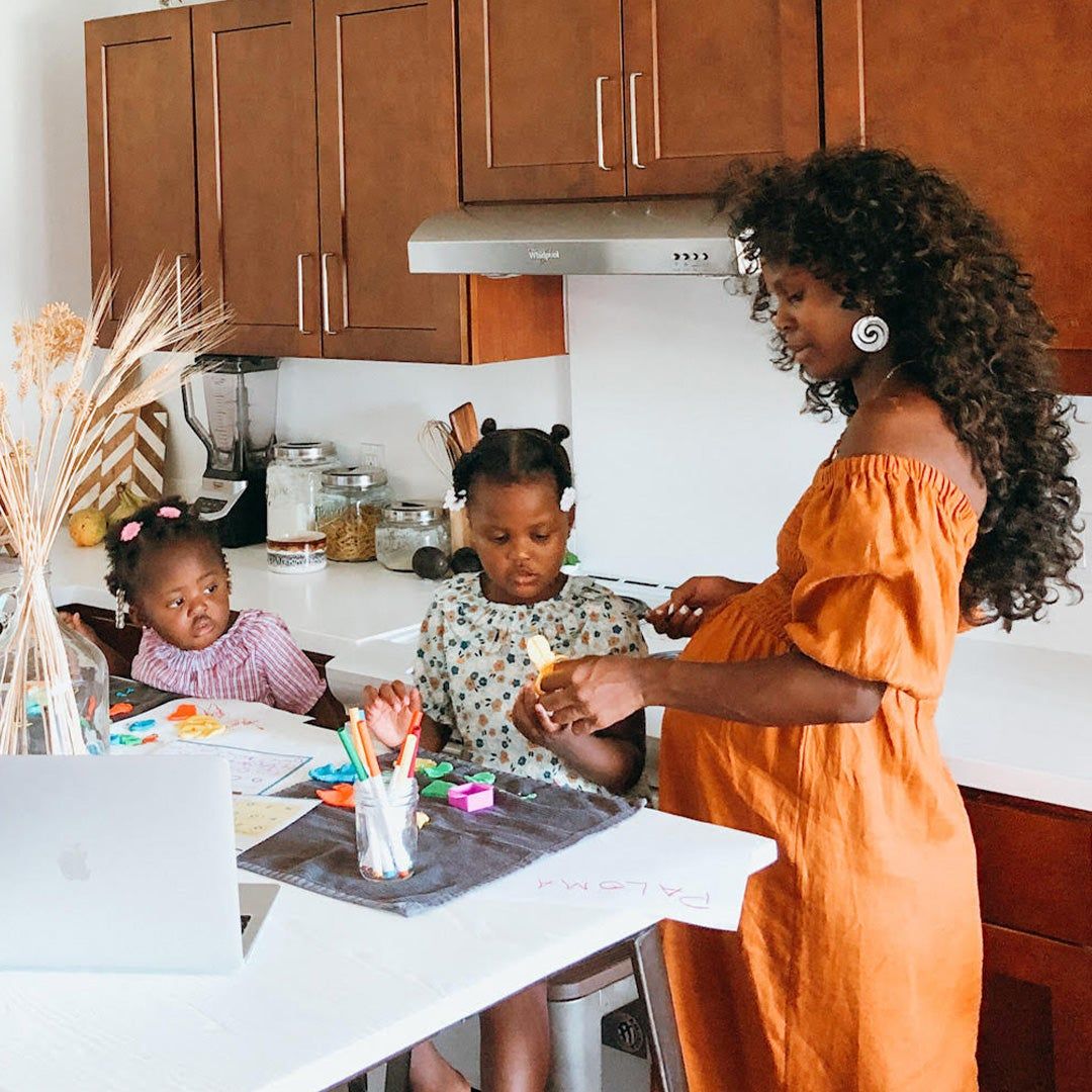 Geena Whyte and her two daughters in their kitchen