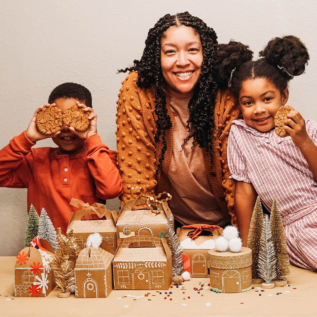 Ashly Rose with her two children and gingerbread houses