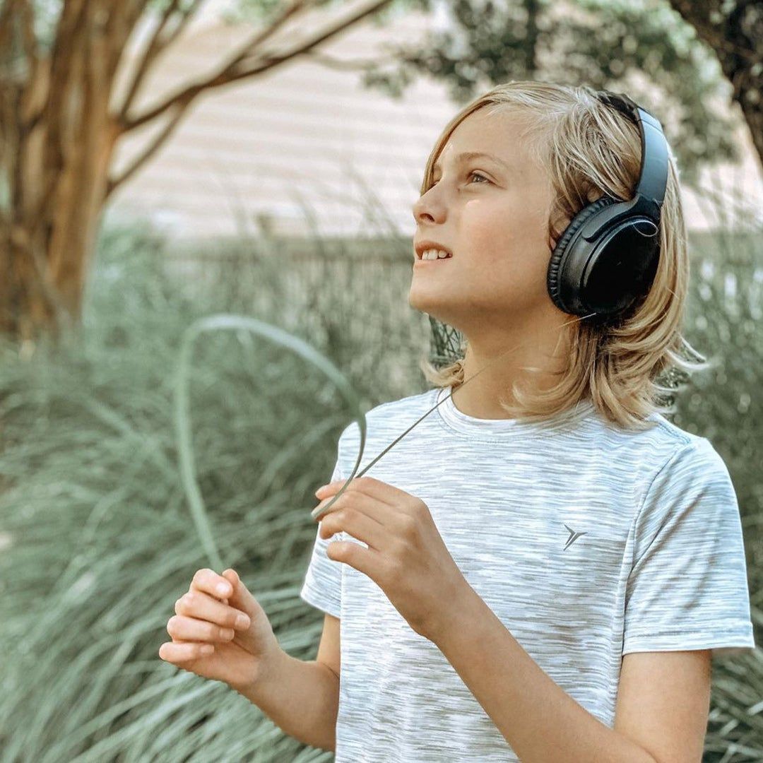 Left: Gabe sitting on the porch and petting his dog; Right: Gabe wearing headphones and looking up at the sky