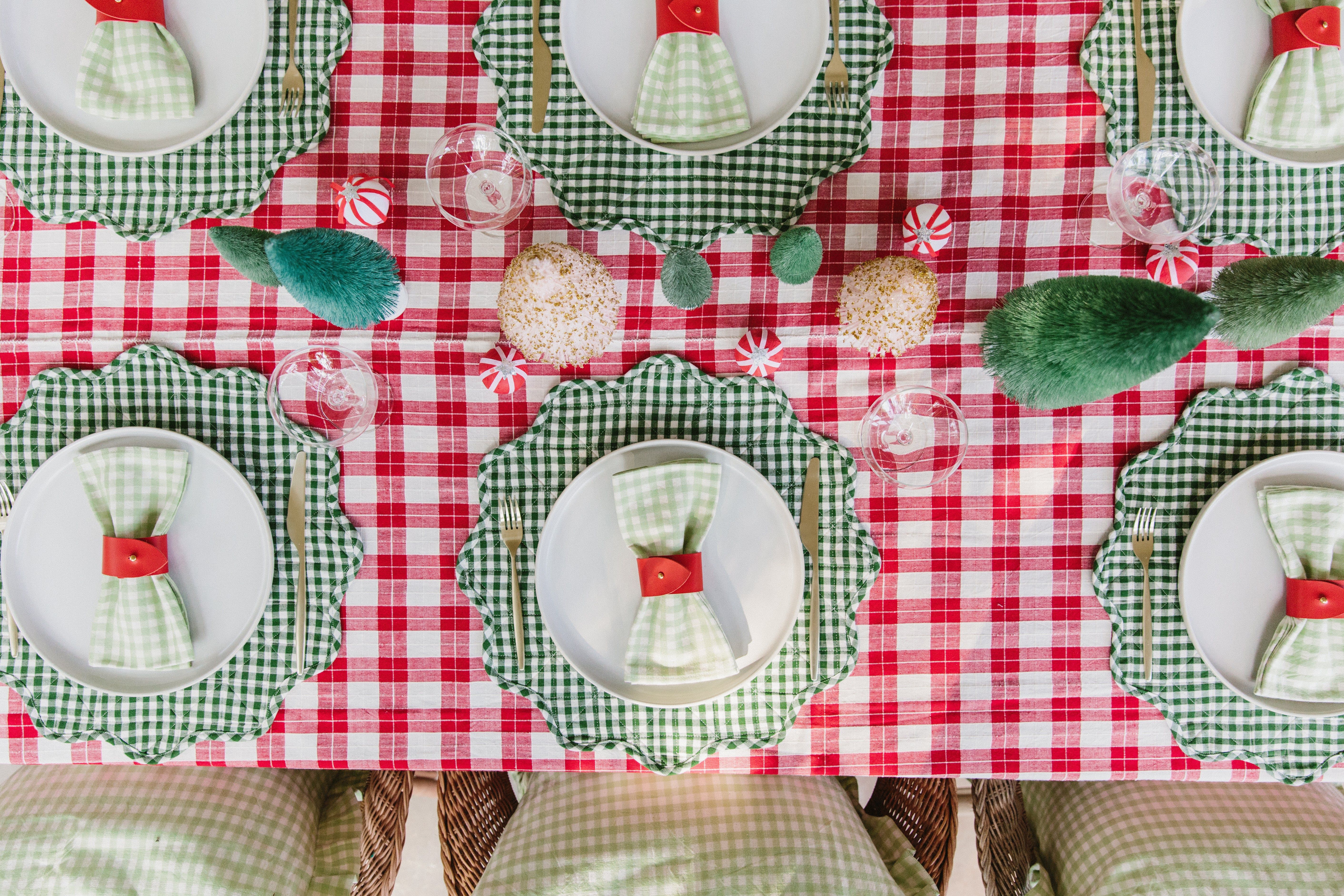 table set with gingham tablecloth, Meri Meri surprise balls and bottle brush trees