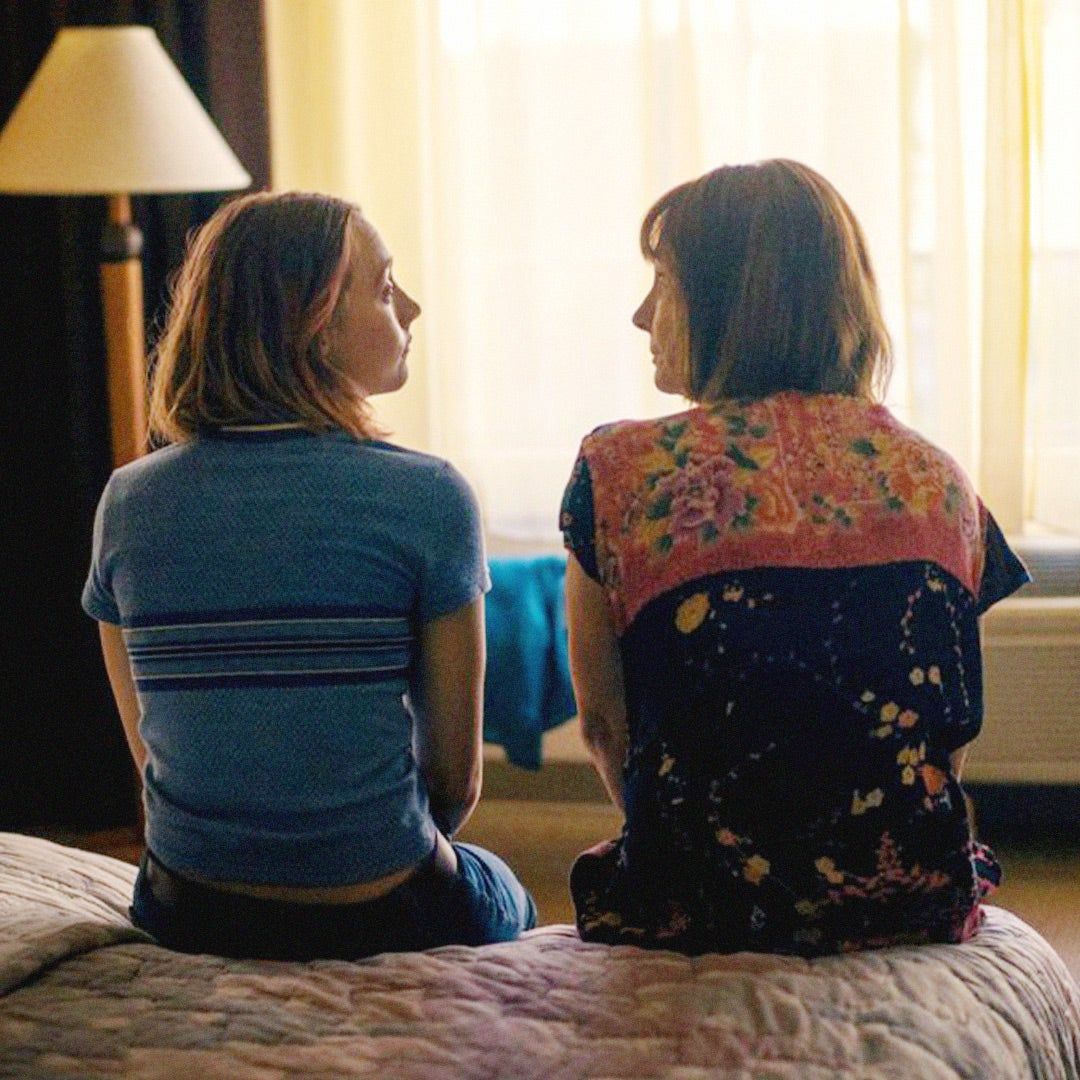 From Lady Bird, Christine and her mother sitting on a bed and talking