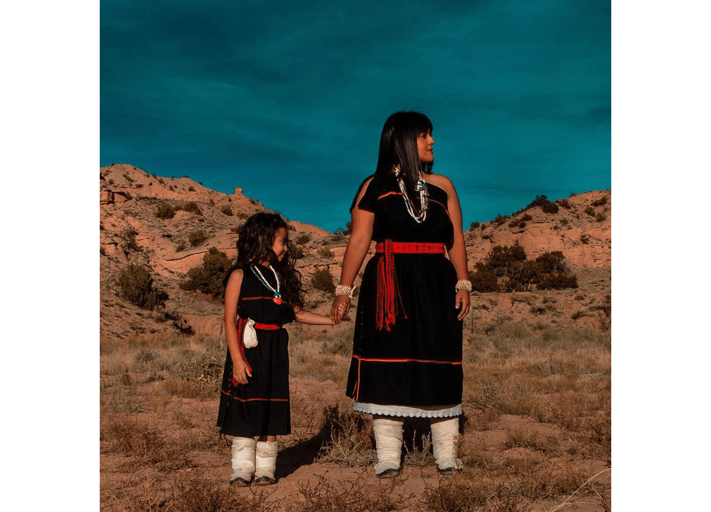 Leah Rose with her daughter in matching dresses in the desert