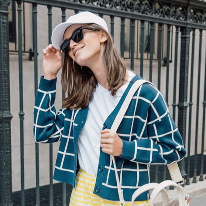 women wearing hat standing outside