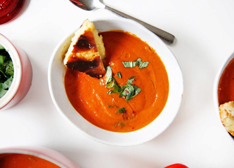 bowl of tomato and basil soup on a counter