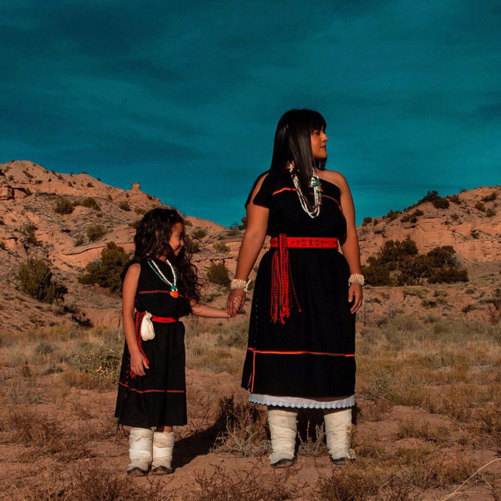 Leah Rose with her daughter in matching dresses in the desert