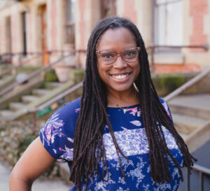 photograph of Dr. Nankia Coor in front of a Brooklyn brownstone street