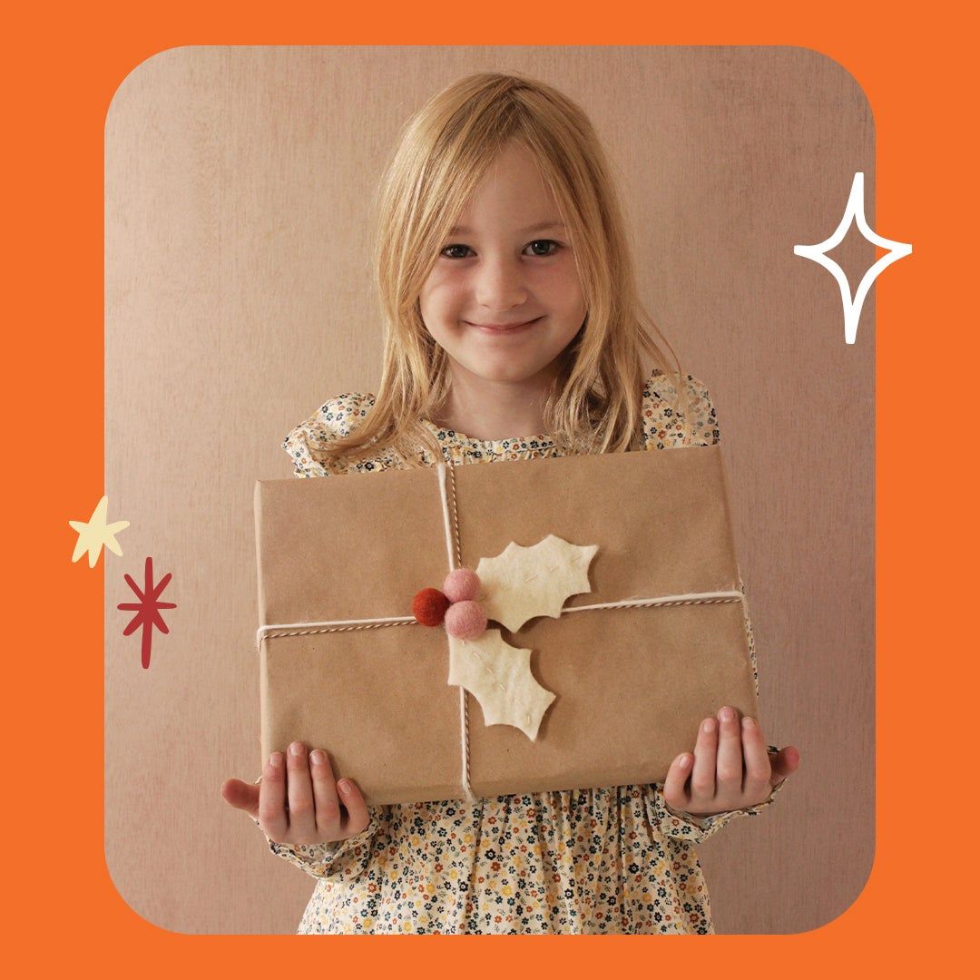 wrapped package with felt holly leaf adornment