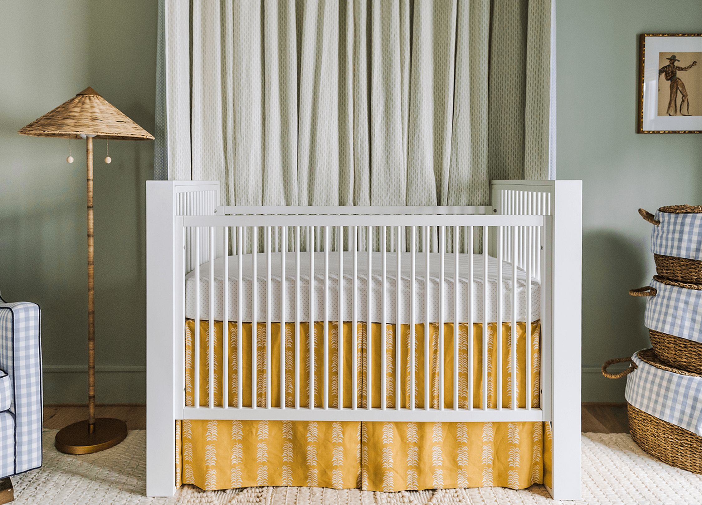 A nursery with a sage green color.