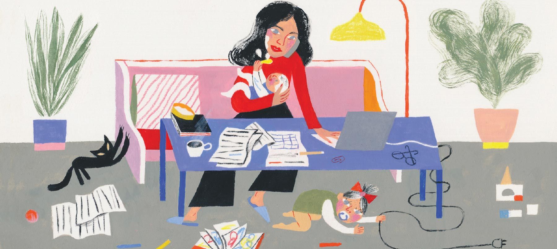 mom holding a baby while trying to work