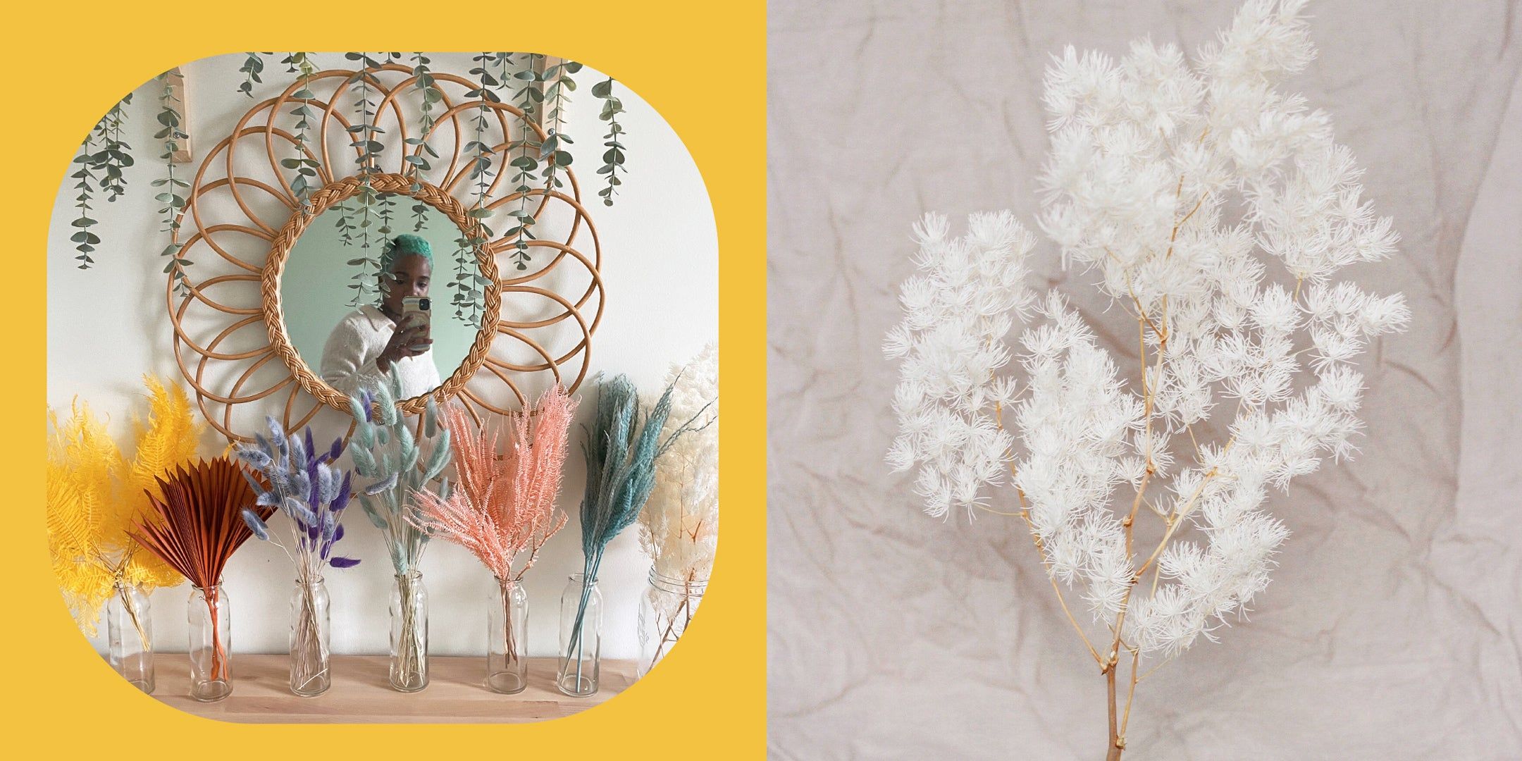 A woman taking a selfie's reflection in a round rattan mirror with colorful single variety flower arrangements in clear glass vases; a white grass stem