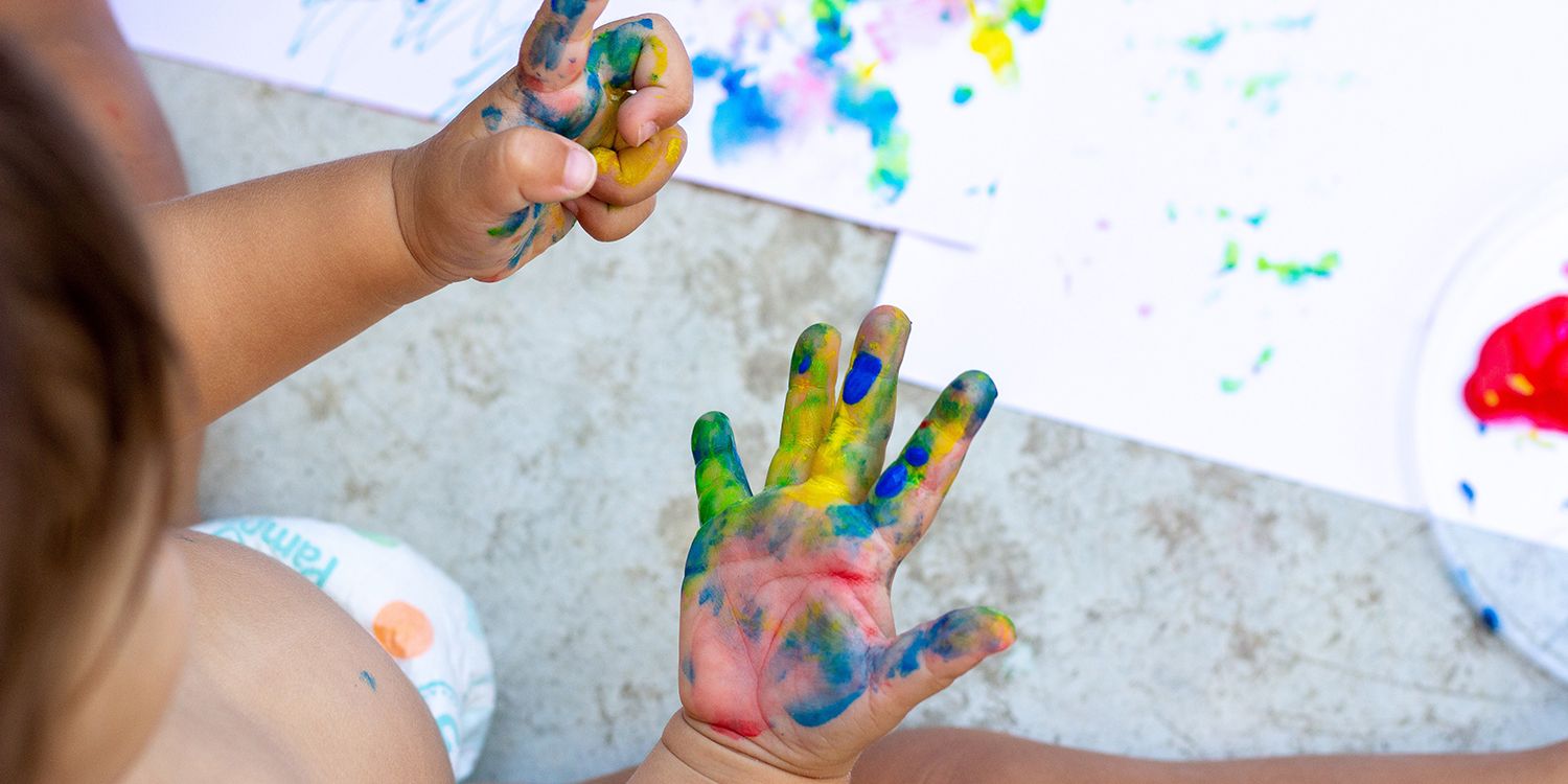 child playing in a sensory bin 