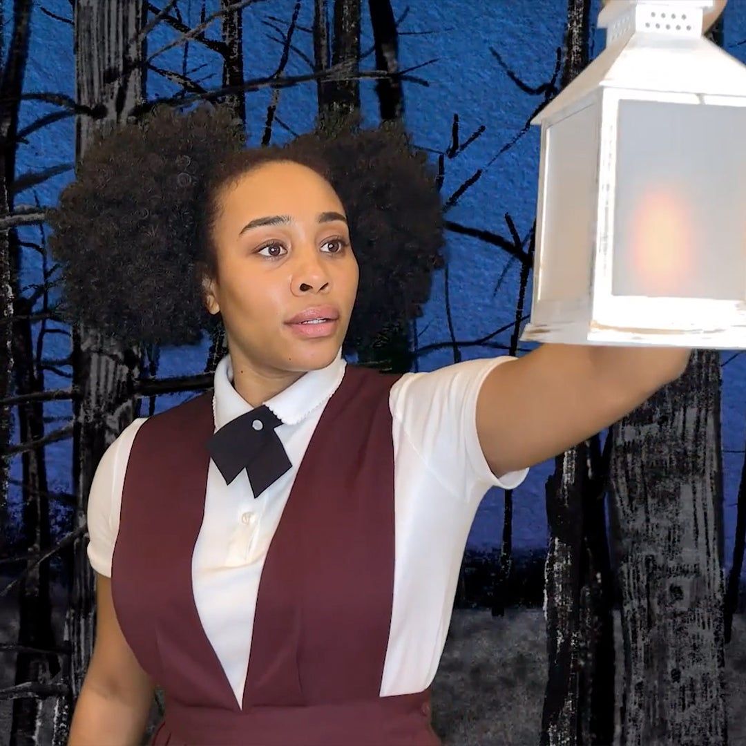 Virtual still of she persisted, the musical with the main character holding a lantern