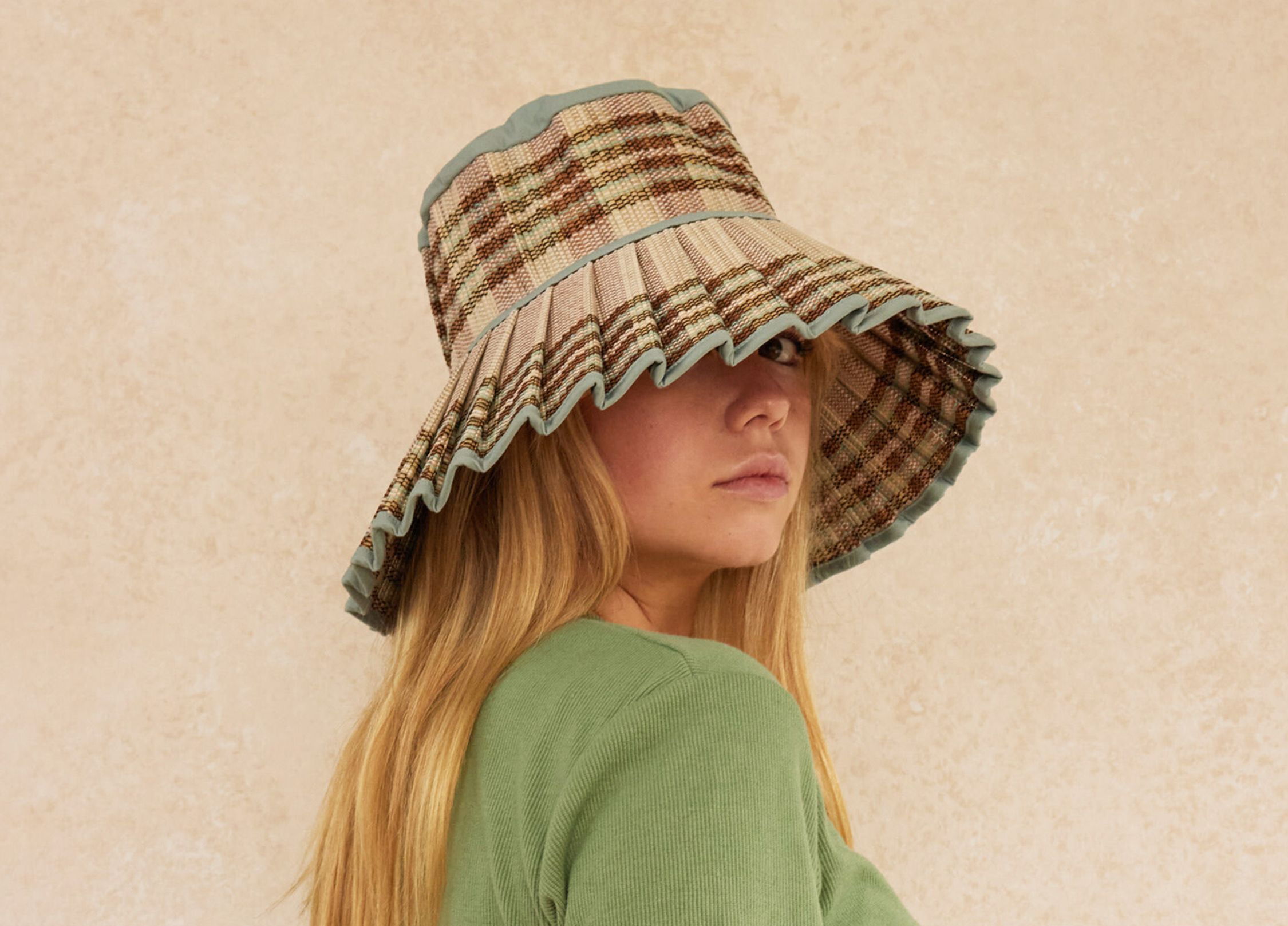 Image of woman wearing sun hat.