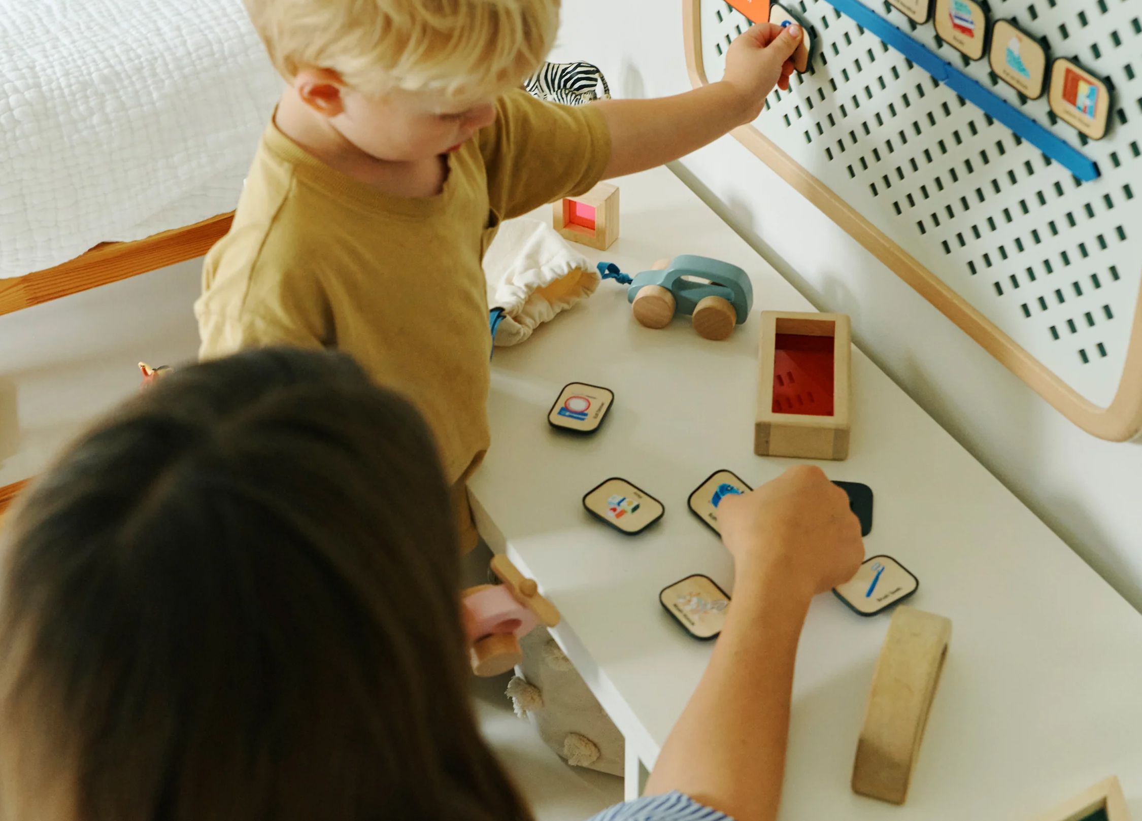 A child and his mother use their Charmspring Springboard.