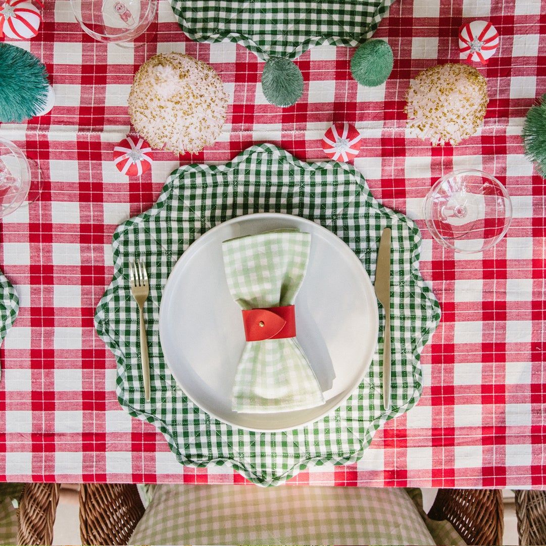 table set with gingham tablecloth, Meri Meri surprise balls and bottle brush trees