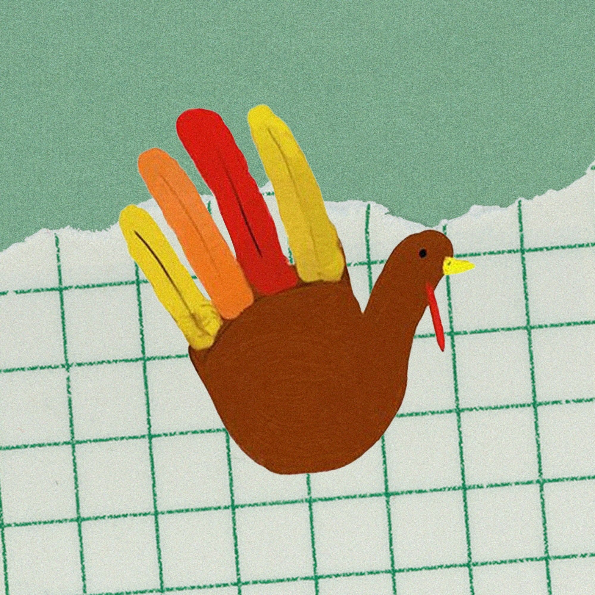 A child's turkey hand craft with a ripped grid paper background