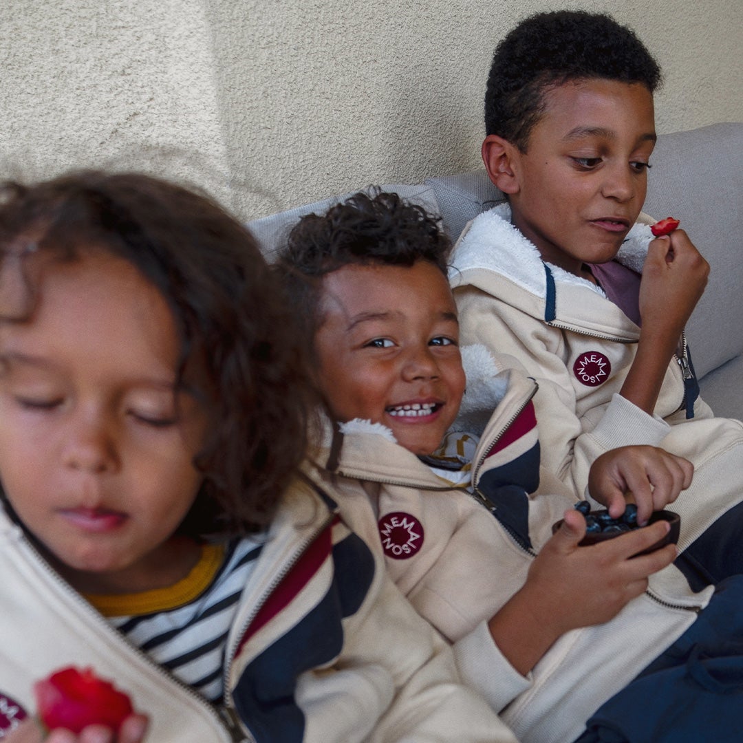 Vanessa's kids working at the computer and eating berries